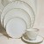 A Giraud & Brousseau Limoges Gold & White 5 Piece Place Setting