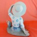 Rex Girl with Hat Sitting Down Legs Out 7" tall