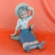 Rex Girl with Hat Sitting Down Legs Out 7" tall